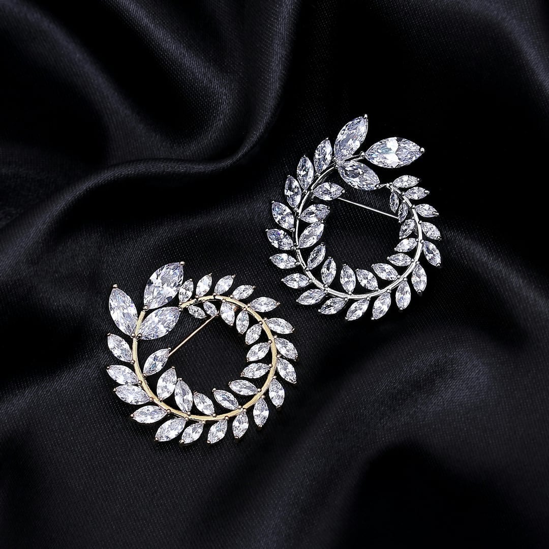 Laurel diamond earrings resting on black satin